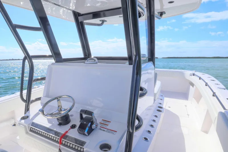  Yacht Photos Pics 2025 Invincible 35 Catamaran helm with ocean view, showcasing sleek design and modern controls.