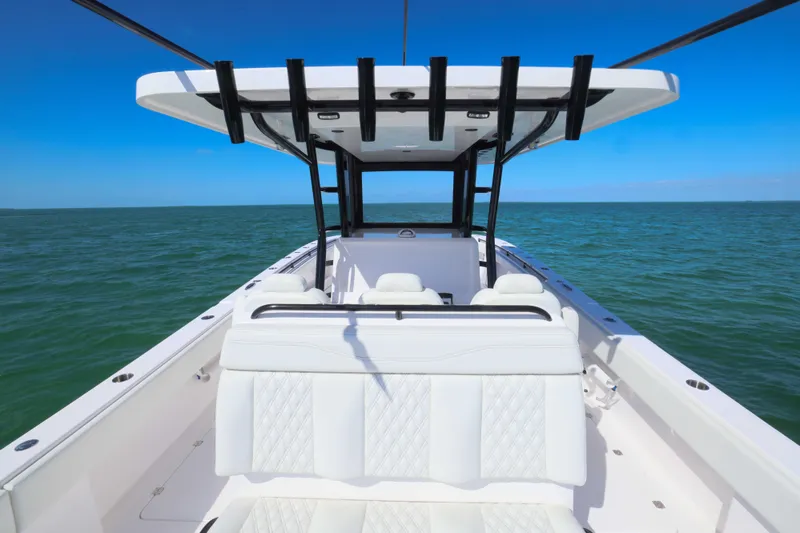  Yacht Photos Pics 2025 Invincible 35 Catamaran on open water, featuring sleek design and spacious seating.