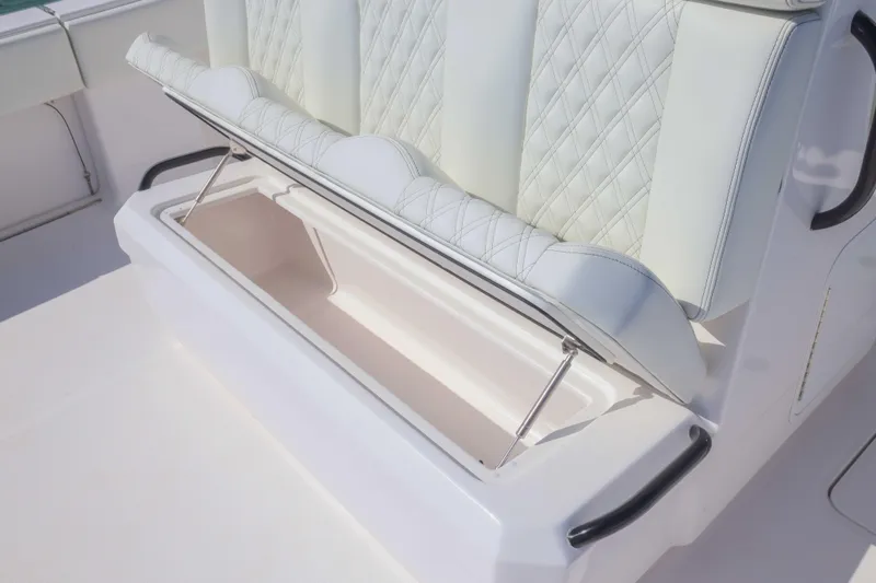  Yacht Photos Pics 2025 Invincible 35 Catamaran seat with storage compartment open, showcasing luxury design.