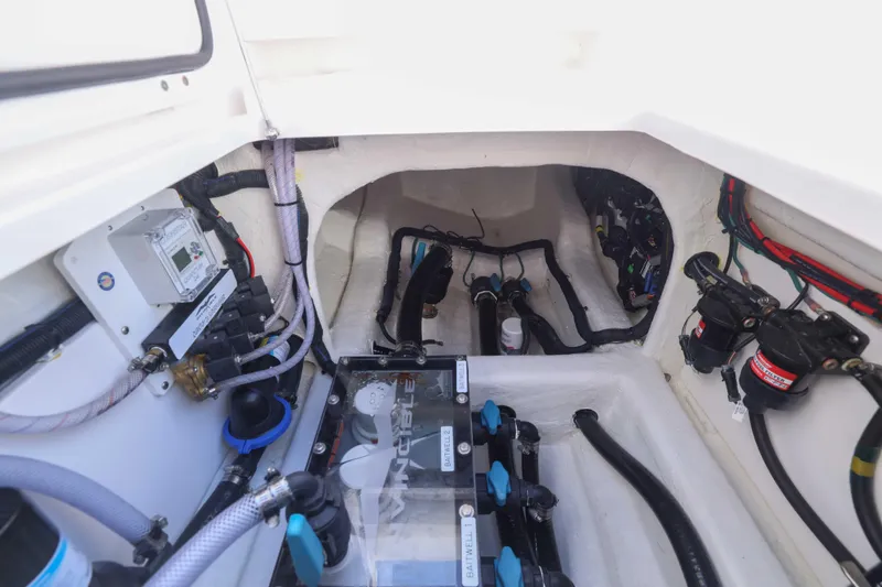  Yacht Photos Pics Engine compartment of 2025 Invincible 35 Catamaran, showcasing wiring and mechanical components.