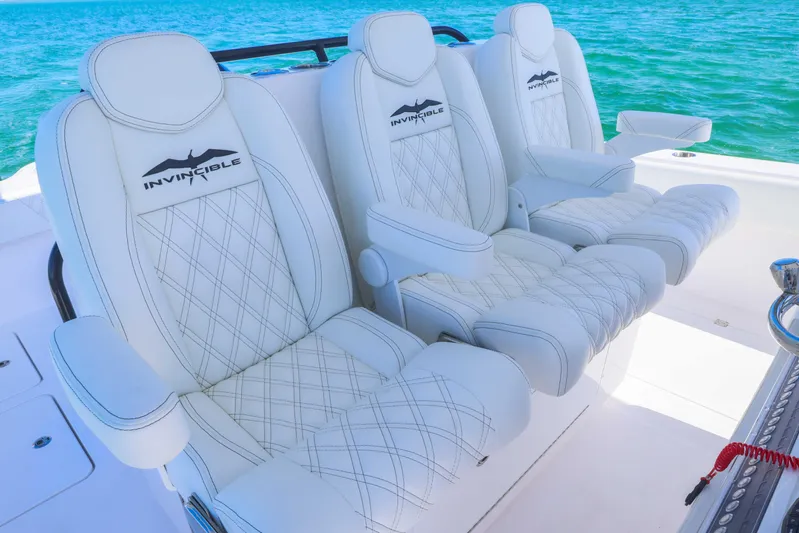  Yacht Photos Pics Luxurious seating on 2025 Invincible 35 Catamaran, featuring white leather with diamond stitching.