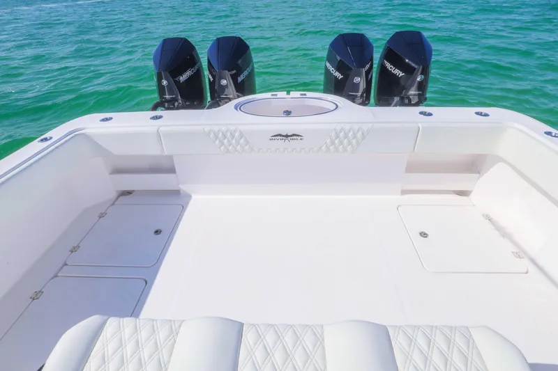  Yacht Photos Pics 2025 Invincible 35 Catamaran with quad Mercury engines on turquoise water.