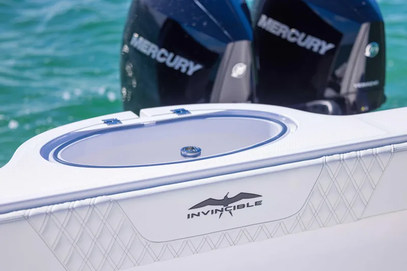  Yacht Photos Pics 2025 Invincible 35 Catamaran with Mercury engines on turquoise water.