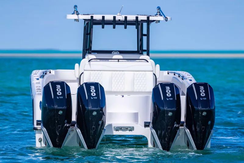  Yacht Photos Pics 2025 Invincible 35 Catamaran with four powerful Mercury 300 V8 engines on blue water.