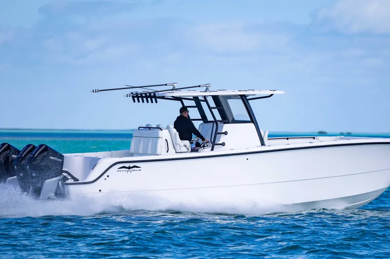  Yacht Photos Pics 2025 Invincible 35 Catamaran cruising on open water, showcasing sleek design and powerful engines.