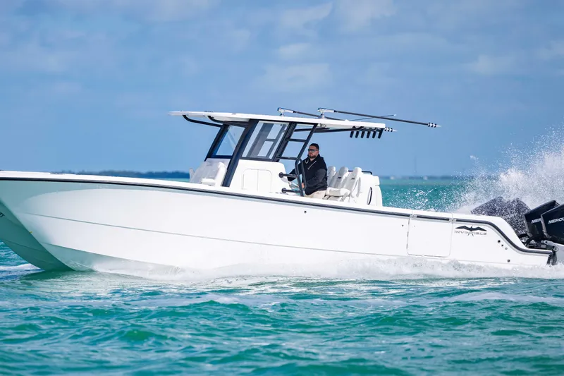  Yacht Photos Pics 2025 Invincible 35 Catamaran cruising on open water, showcasing sleek design and performance.