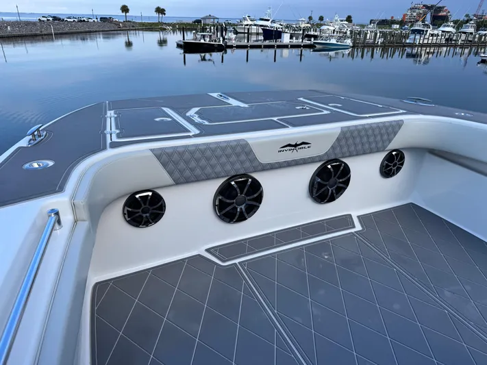  Yacht Photos Pics 2022 Invincible 40 Catamaran at marina, featuring sleek deck design and modern speakers.