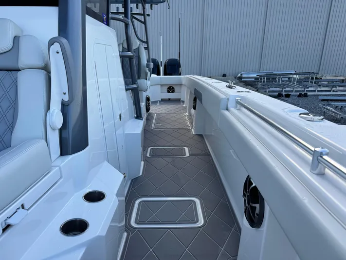  Yacht Photos Pics 2022 Invincible 40 Catamaran interior with sleek seating and modern design features.
