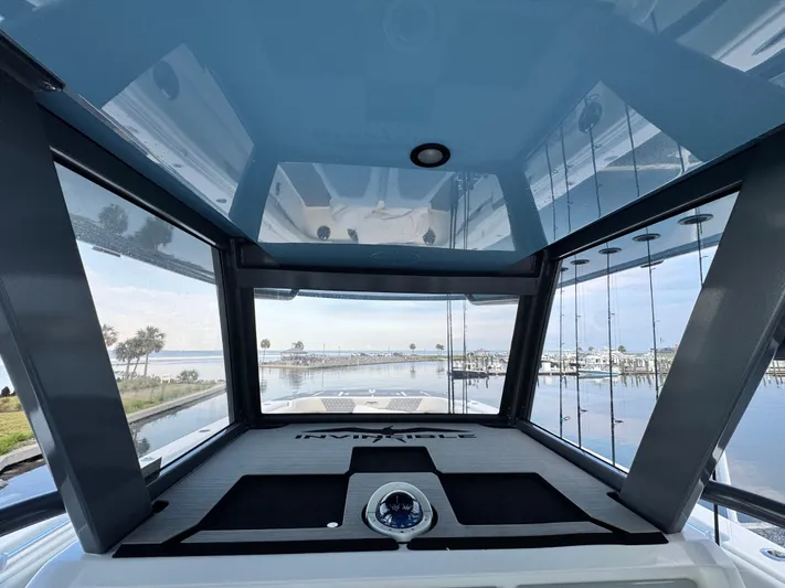  Yacht Photos Pics Interior view of 2022 Invincible 40 Catamaran, showcasing sleek design and panoramic windows.