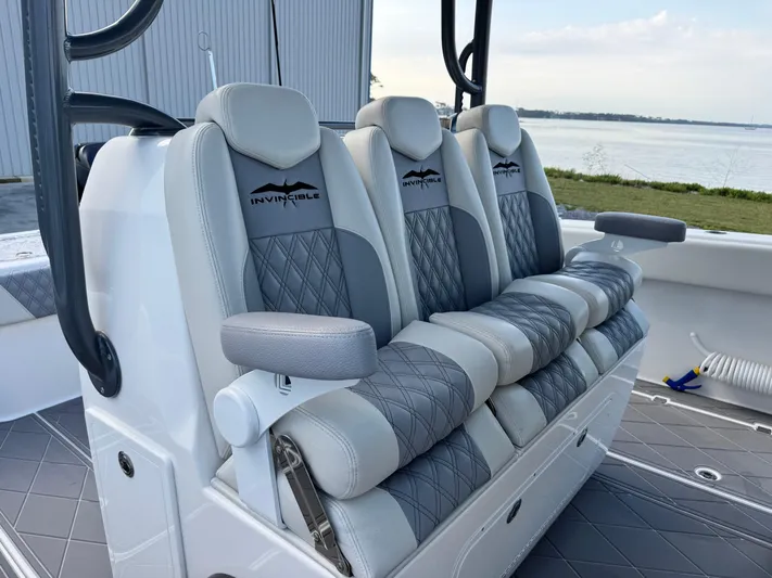  Yacht Photos Pics Luxurious seating on 2022 Invincible 40 Catamaran, featuring elegant gray and white upholstery.