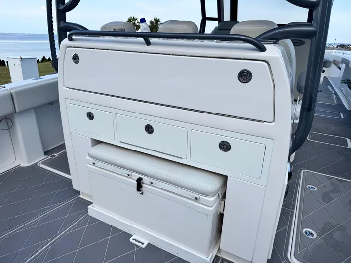  Yacht Photos Pics 2022 Invincible 40 Catamaran interior with storage drawers and cushioned seating.