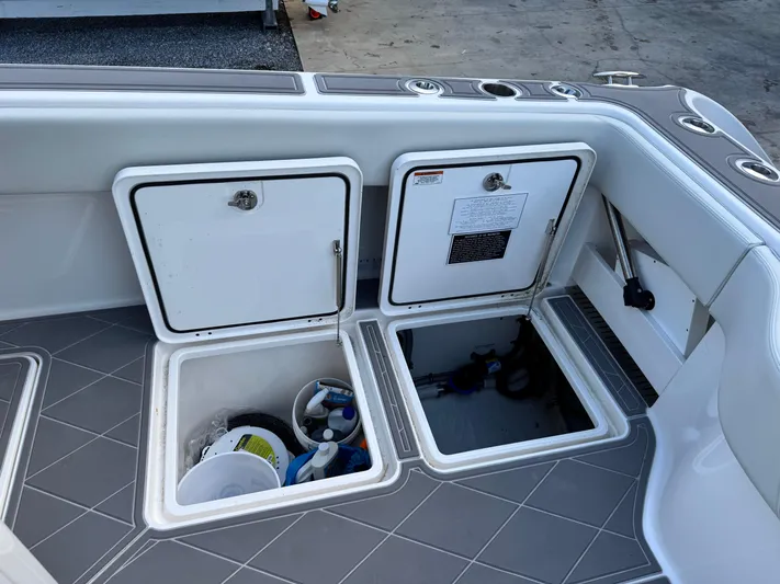  Yacht Photos Pics Storage compartments on 2022 Invincible 40 Catamaran, featuring organized interior and sleek design.