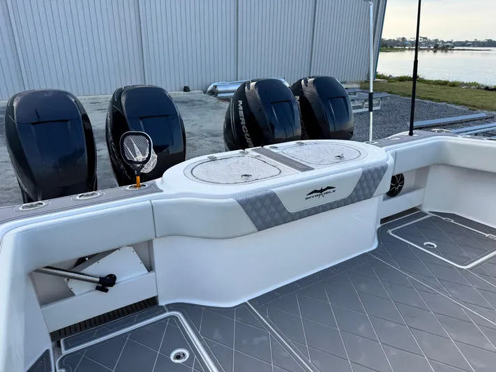  Yacht Photos Pics 2022 Invincible 40 Catamaran with four powerful outboard engines, sleek design, and spacious deck.