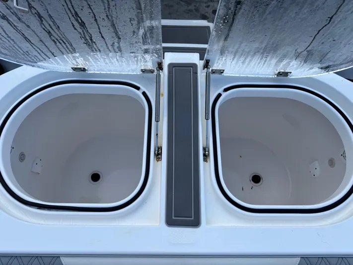  Yacht Photos Pics Open storage compartments on a 2022 Invincible 40 Catamaran boat.