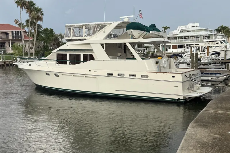 Destination Yacht Photos Pics Luxury 1995 Ocean Alexander 546 yacht docked at marina, featuring elegant design and spacious deck.