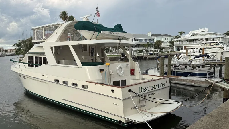 Destination Yacht Photos Pics Ocean Alexander 546 yacht from 1995 docked at a marina, named "Destination."