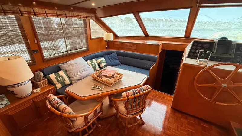 Destination Yacht Photos Pics Luxurious 1995 Ocean Alexander 546 yacht interior with cozy seating and elegant wooden finishes.