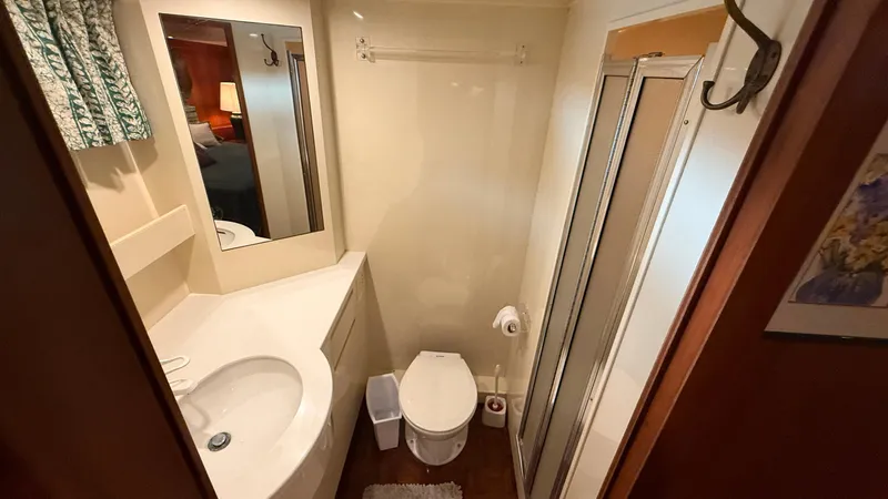 Destination Yacht Photos Pics Bathroom interior of 1995 Ocean Alexander 546 yacht with shower and sink.