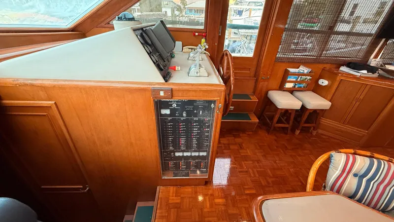 Destination Yacht Photos Pics Interior of 1995 Ocean Alexander 546 yacht with wooden helm and control panel.