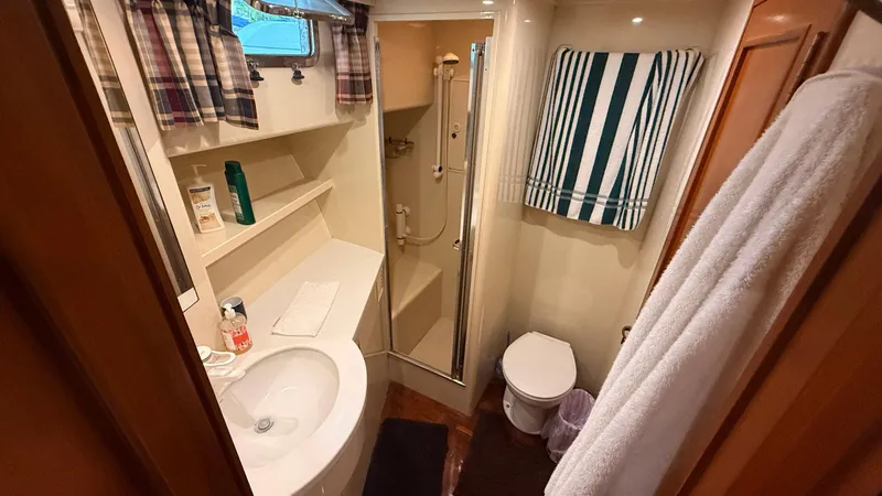 Destination Yacht Photos Pics Bathroom interior of 1995 Ocean Alexander 546 yacht with shower and sink.