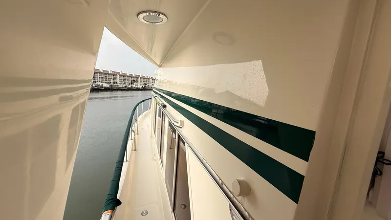 Destination Yacht Photos Pics Side view of 1995 Ocean Alexander 546 yacht docked at marina.