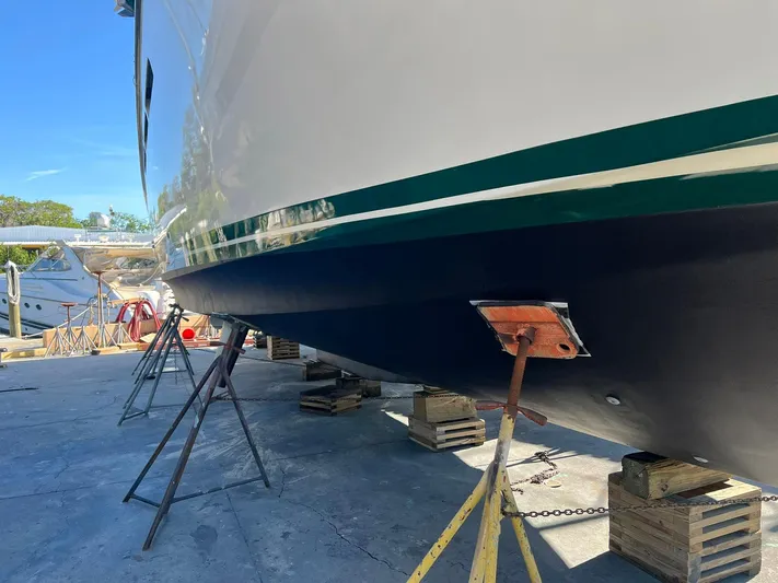 Destination Yacht Photos Pics Ocean Alexander 546 yacht from 1995 on dry dock, supported by stands and blocks.