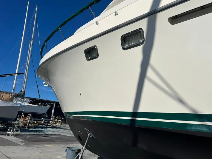 Destination Yacht Photos Pics Ocean Alexander 546 yacht from 1995 in a boatyard, side view.