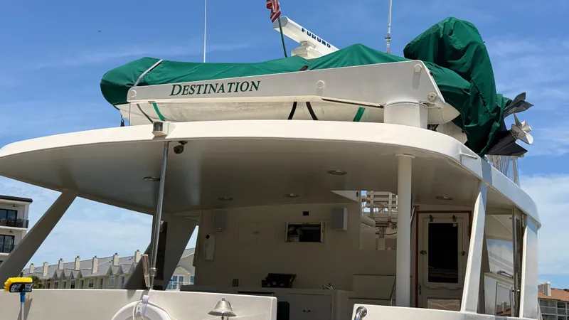 Destination Yacht Photos Pics Ocean Alexander 546 yacht from 1995, named "Destination," docked under a clear blue sky.