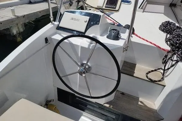 Susie Sea Yacht Photos Pics Steering wheel of 2019 Nautitech 46 Open catamaran, featuring modern design and nautical equipment.