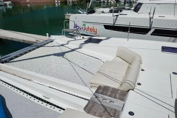 Susie Sea Yacht Photos Pics 2019 Nautitech 46 Open catamaran with spacious deck and netting, docked in marina.