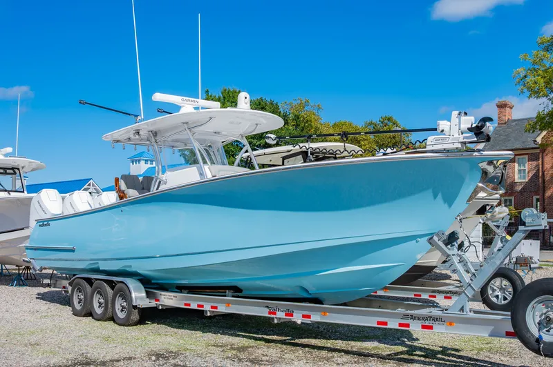 Gypsum Road Yacht Photos Pics 2025 Valhalla Boatworks 37 on trailer, light blue hull, parked outdoors.