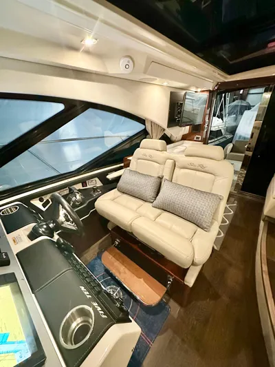 Perridice Yacht Photos Pics 2017 Sea Ray Sundancer 510 interior with plush seating and modern dashboard.
