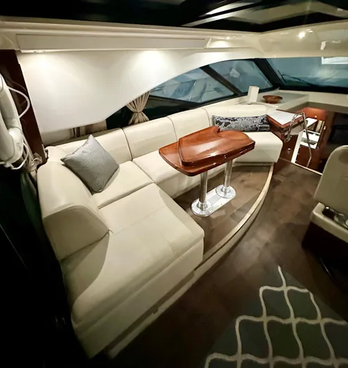 Perridice Yacht Photos Pics Luxurious interior of 2017 Sea Ray Sundancer 510 yacht with elegant seating and wooden table.