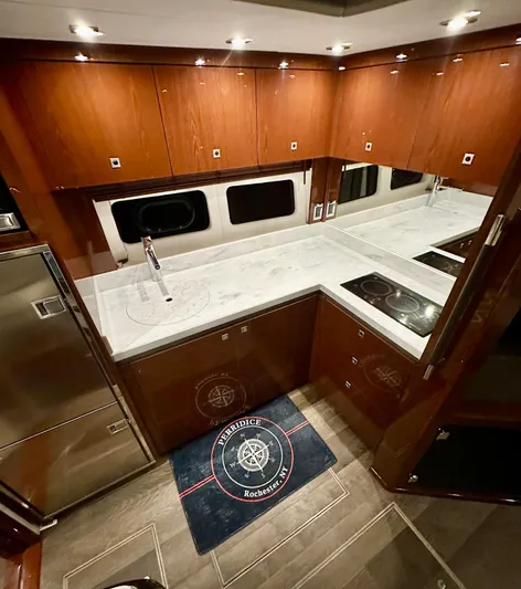 Perridice Yacht Photos Pics Luxurious kitchen interior of 2017 Sea Ray Sundancer 510 yacht with modern appliances.