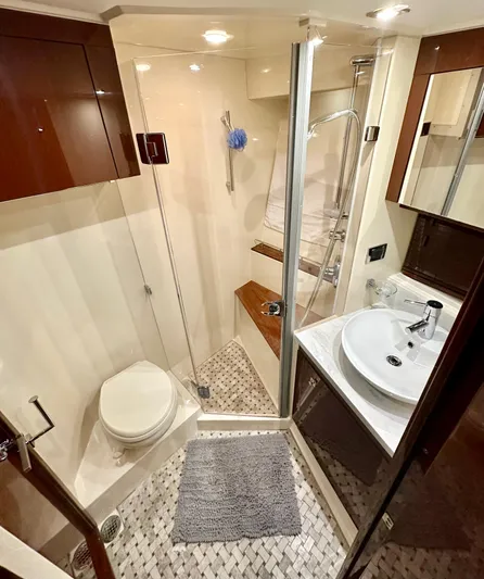 Perridice Yacht Photos Pics Luxurious bathroom in 2017 Sea Ray Sundancer 510 yacht with modern fixtures and elegant design.