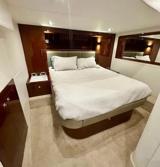 Perridice Yacht Photos Pics Luxurious bedroom interior of 2017 Sea Ray Sundancer 510 yacht with elegant bedding and wood accents.