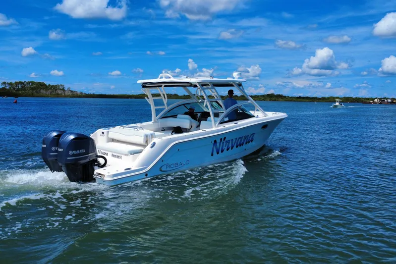  Yacht Photos Pics 2019 Robalo R317 Dual Console boat cruising on a sunny day with Yamaha engines.