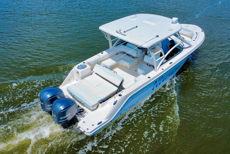  Yacht Photos Pics 2019 Robalo R317 Dual Console boat cruising on water with twin Yamaha engines.