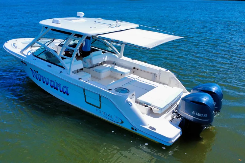  Yacht Photos Pics 2019 Robalo R317 Dual Console boat on water, featuring Yamaha engines and a spacious deck.