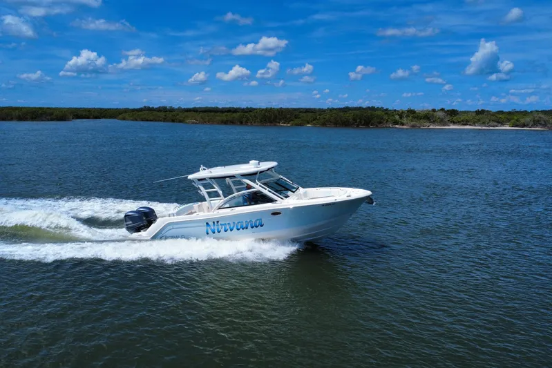  Yacht Photos Pics 2019 Robalo R317 Dual Console boat cruising on a sunny day.
