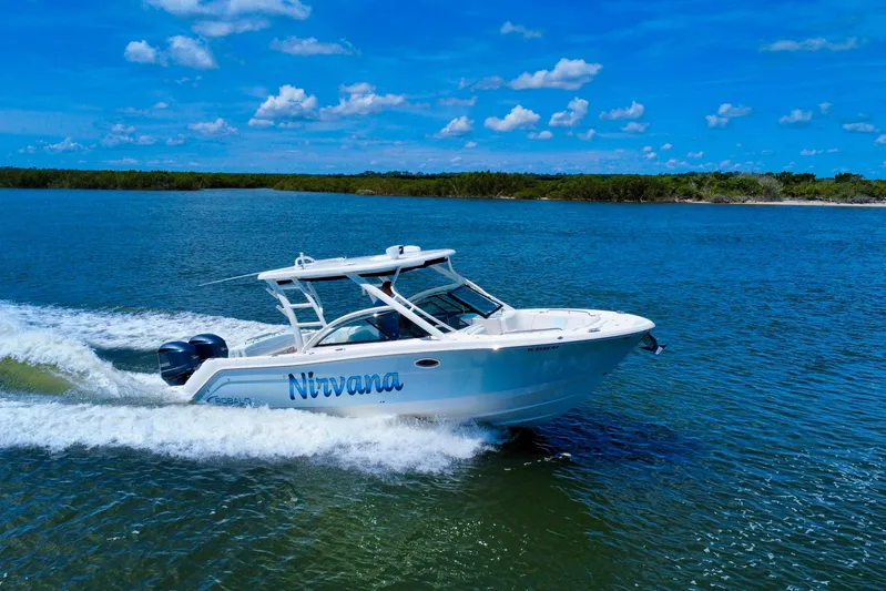  Yacht Photos Pics 2019 Robalo R317 Dual Console boat cruising on a sunny day.