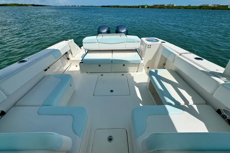  Yacht Photos Pics 2019 Robalo R317 Dual Console boat interior with spacious seating on calm water.