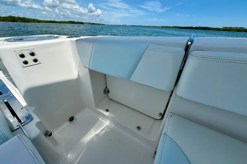  Yacht Photos Pics 2019 Robalo R317 Dual Console boat interior with seating, ocean view, and clear sky.