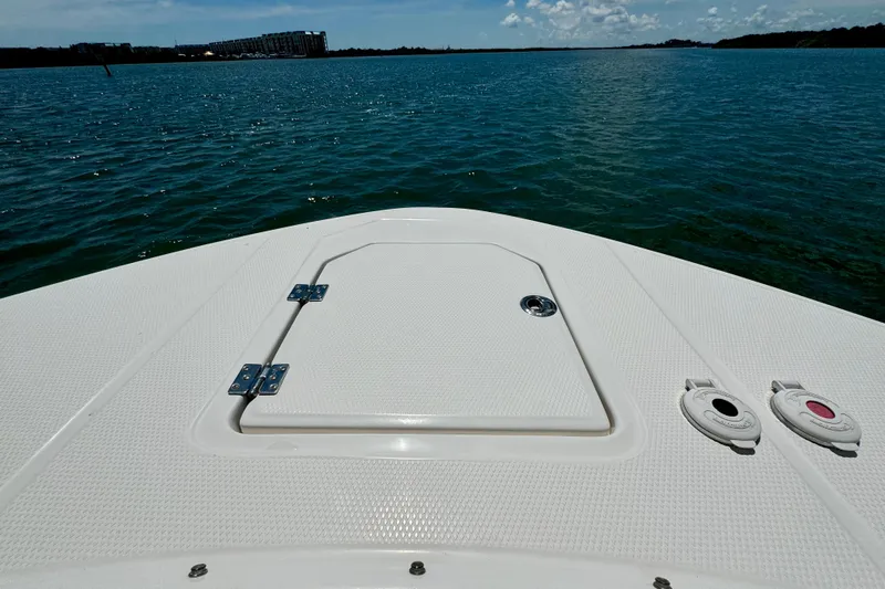 Yacht Photos Pics 2019 Robalo R317 Dual Console boat deck on calm water, sunny day.