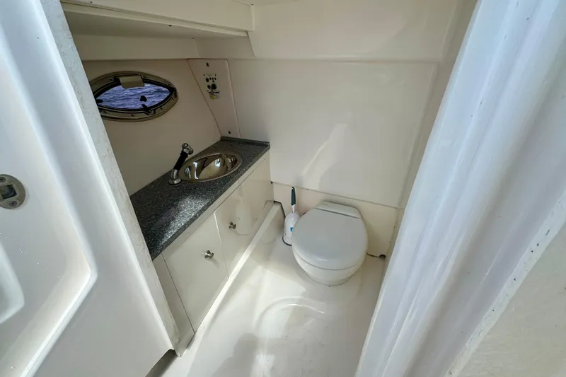  Yacht Photos Pics 2019 Robalo R317 Dual Console boat bathroom with sink and toilet.