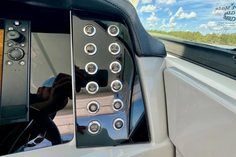  Yacht Photos Pics Control panel of 2019 Robalo R317 Dual Console boat with various buttons and switches.