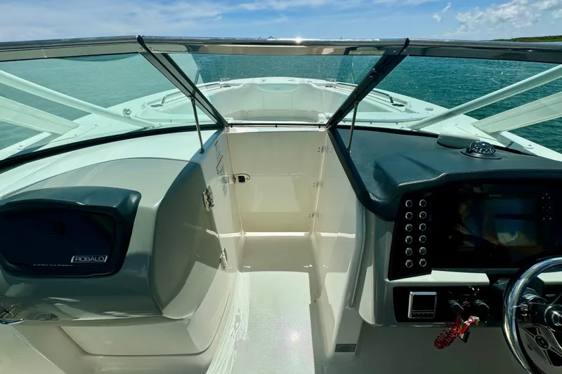  Yacht Photos Pics 2019 Robalo R317 Dual Console boat interior with steering wheel and dashboard.
