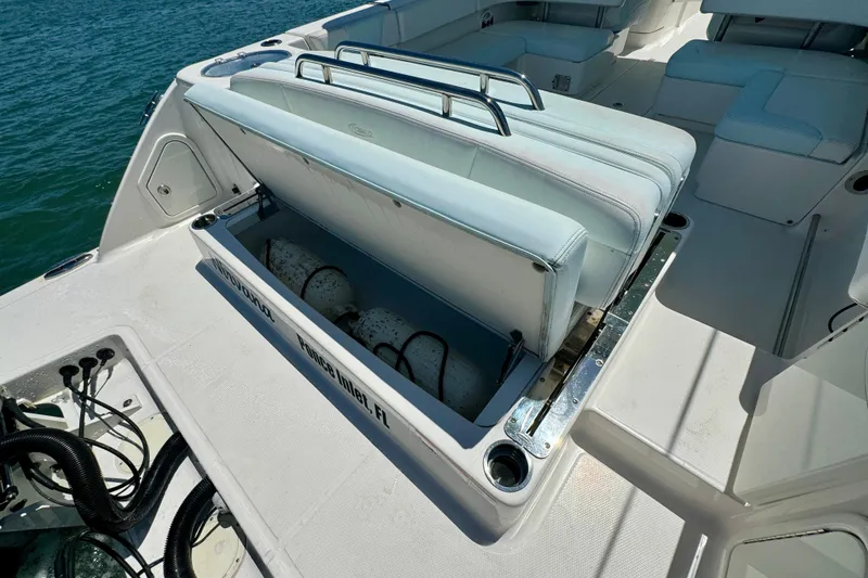 Yacht Photos Pics 2019 Robalo R317 Dual Console boat with open storage compartment on deck.