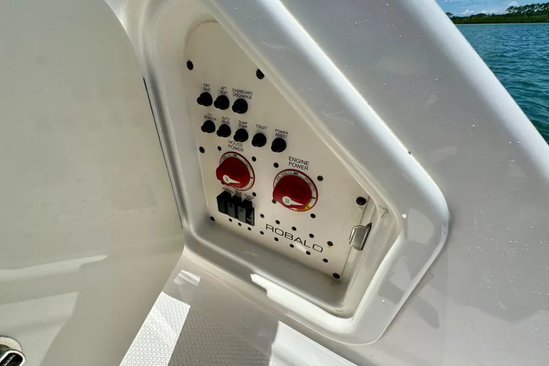  Yacht Photos Pics Control panel of 2019 Robalo R317 Dual Console boat, featuring switches and power controls.