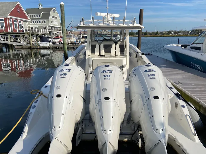  Yacht Photos Pics 2022 Pursuit 378S boat with triple 425 V8 engines docked at a marina.